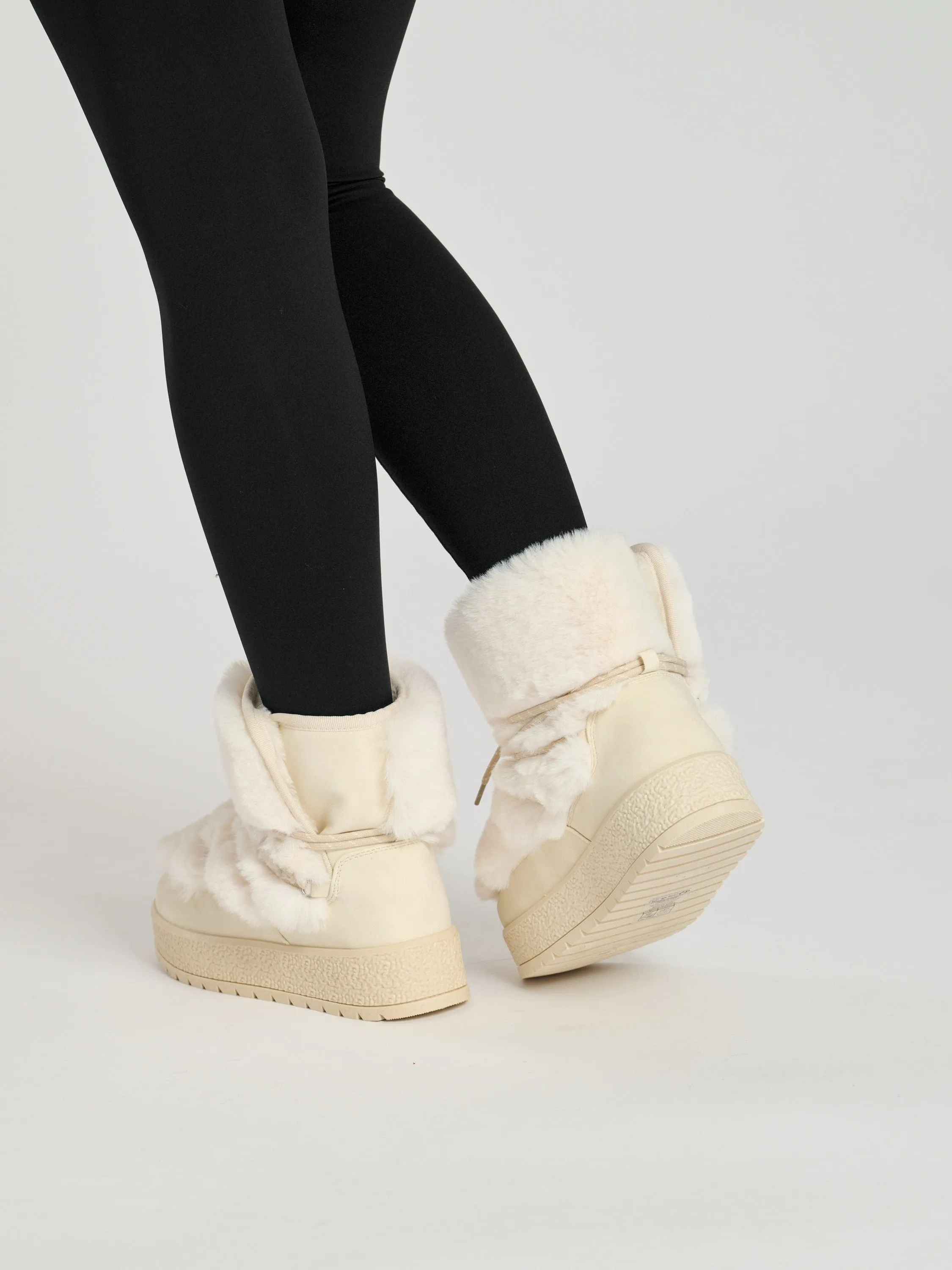 The 'Sleet' faux fur lace up snow boots in vanilla
