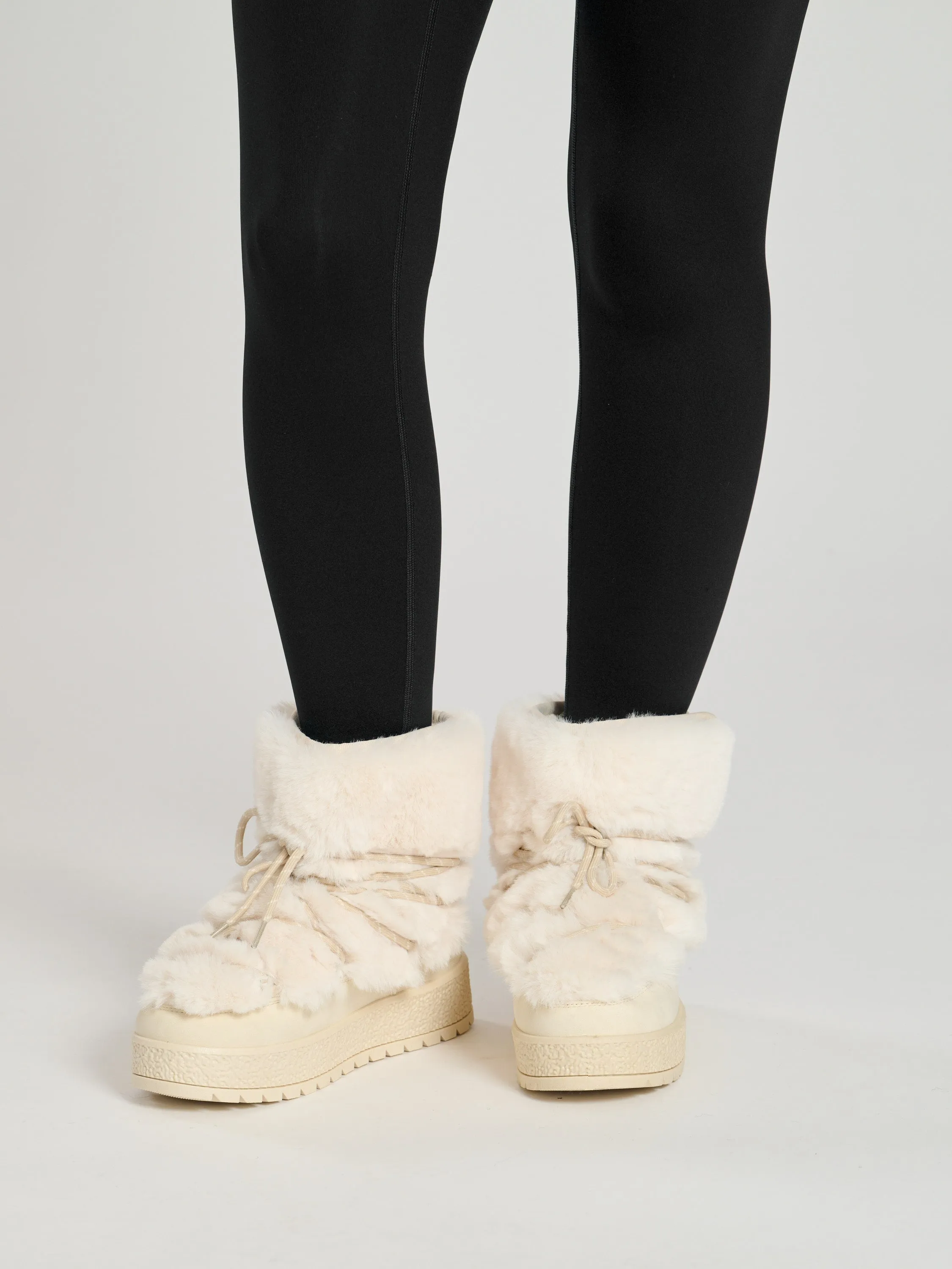 The 'Sleet' faux fur lace up snow boots in vanilla